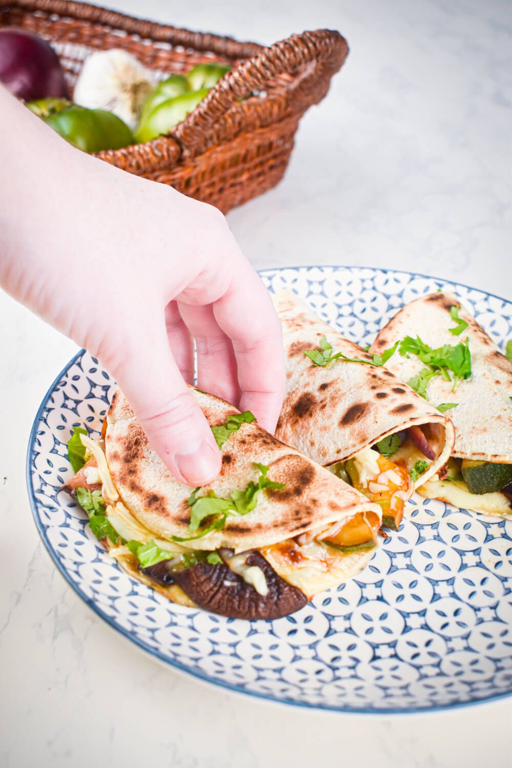 Mushroom quesadillas with portobellows, zucchini, onions, cheese, and cilantro in a flour tortilla.