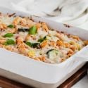 Baked Roasted Vegetable Ziti Roasted Vegetable Baked Ziti with melted cheese in a white casserole dish.