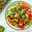 Sheet Pan Pesto Chickpeas and Vegetables Sheet pan pesto chickpeas and vegetables on a plate with asparagus, sweet potatoes, chickpeas, carrots, cauliflower, and peppers.
