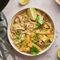 Slow Cooker White Chicken Chili Slow cooker white chicken chili with shredded chicken, green chilies, white beans, tortilla chips, cilantro, and lime.