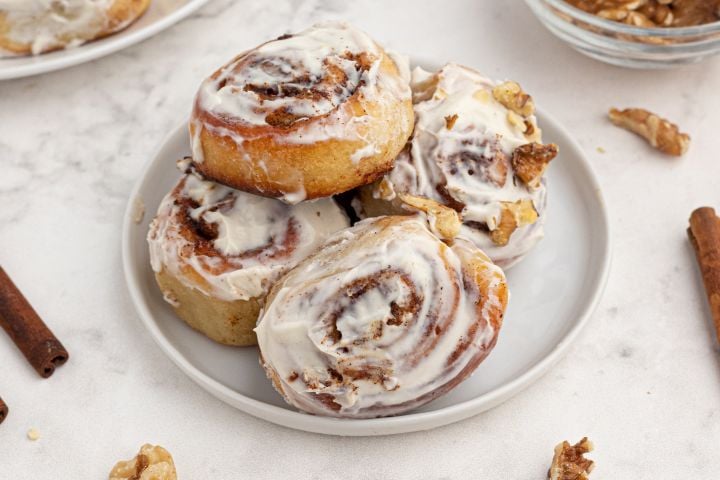 Easy Cinnamon Rolls (with Two Ingredient Dough!) Easy cinnamon rolls made with two ingredient dough and topped with cream cheese glaze and cinnamon.