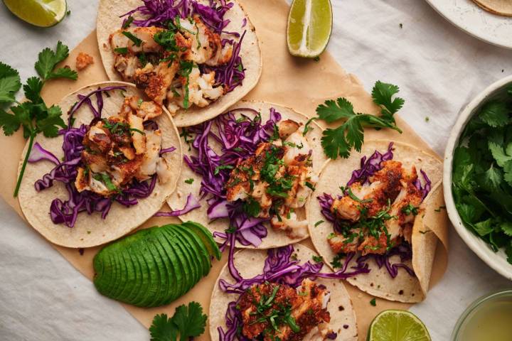 36 BEST Healthy Taco Recipes Fish tacos with flaky seasoned fish served in a corn tortilla with cilantro, shredded red cabbage, and limes.