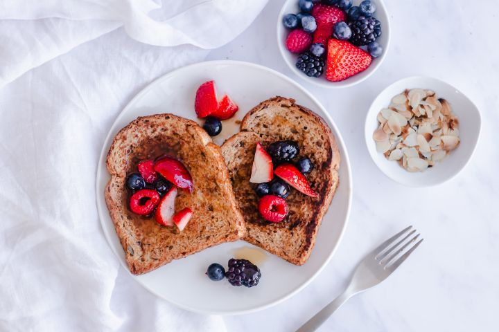 Healthy French Toast Healthy French toast made with whole wheat bread and topped with fresh berries and almonds.