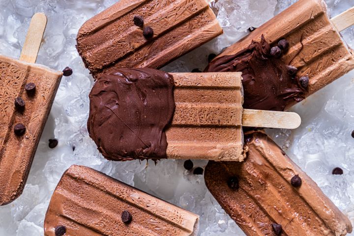 Healthy Fudgesicles Healthy fudgesicles made with Greek yogurt frozen with chocolate chips.