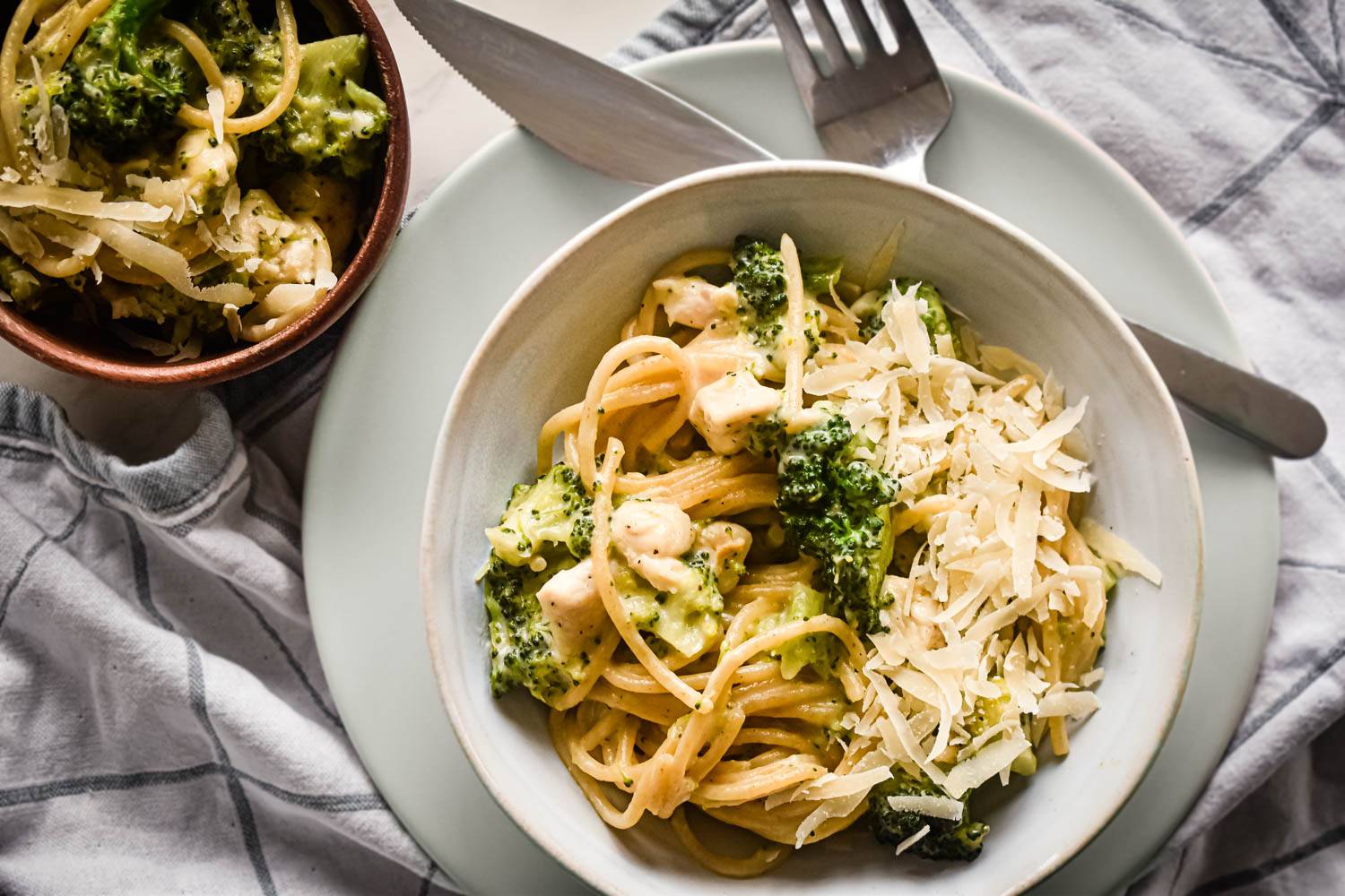 Easy healthy pasta recipe for chicken, broccoli, and spaghetti pasta with Parmesan cheese.