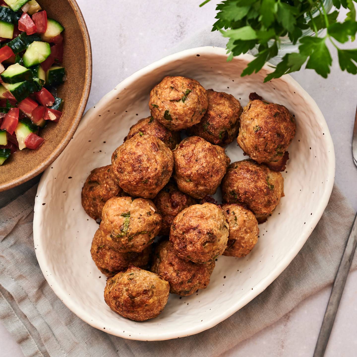 Greek meatballs with cucumber salad and tzatziki.