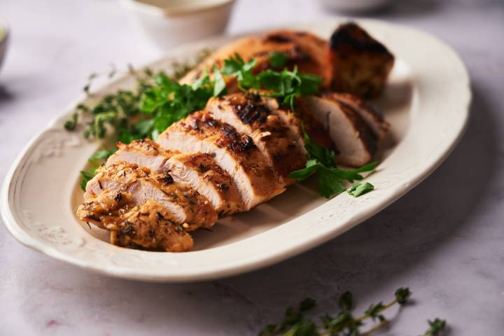 Sliced turkey breast tenderloin on a plate.