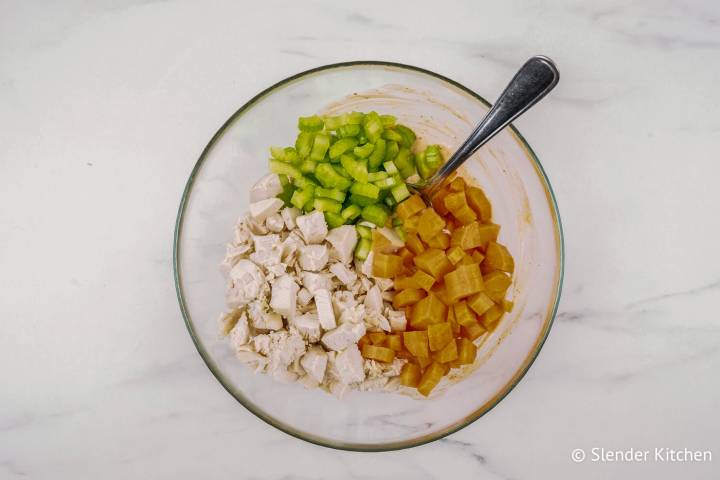 Celery, carrots, and chopped chicken mixed with buffalo ranch dressing.