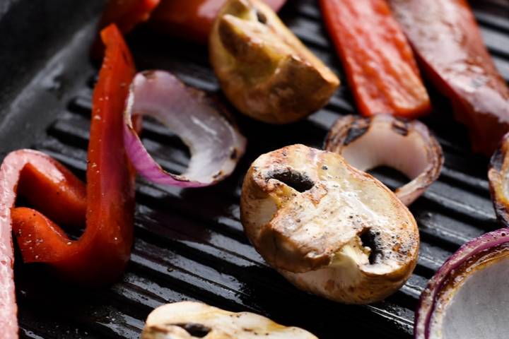 Mushrooms, red peppers, and onions on the grill.