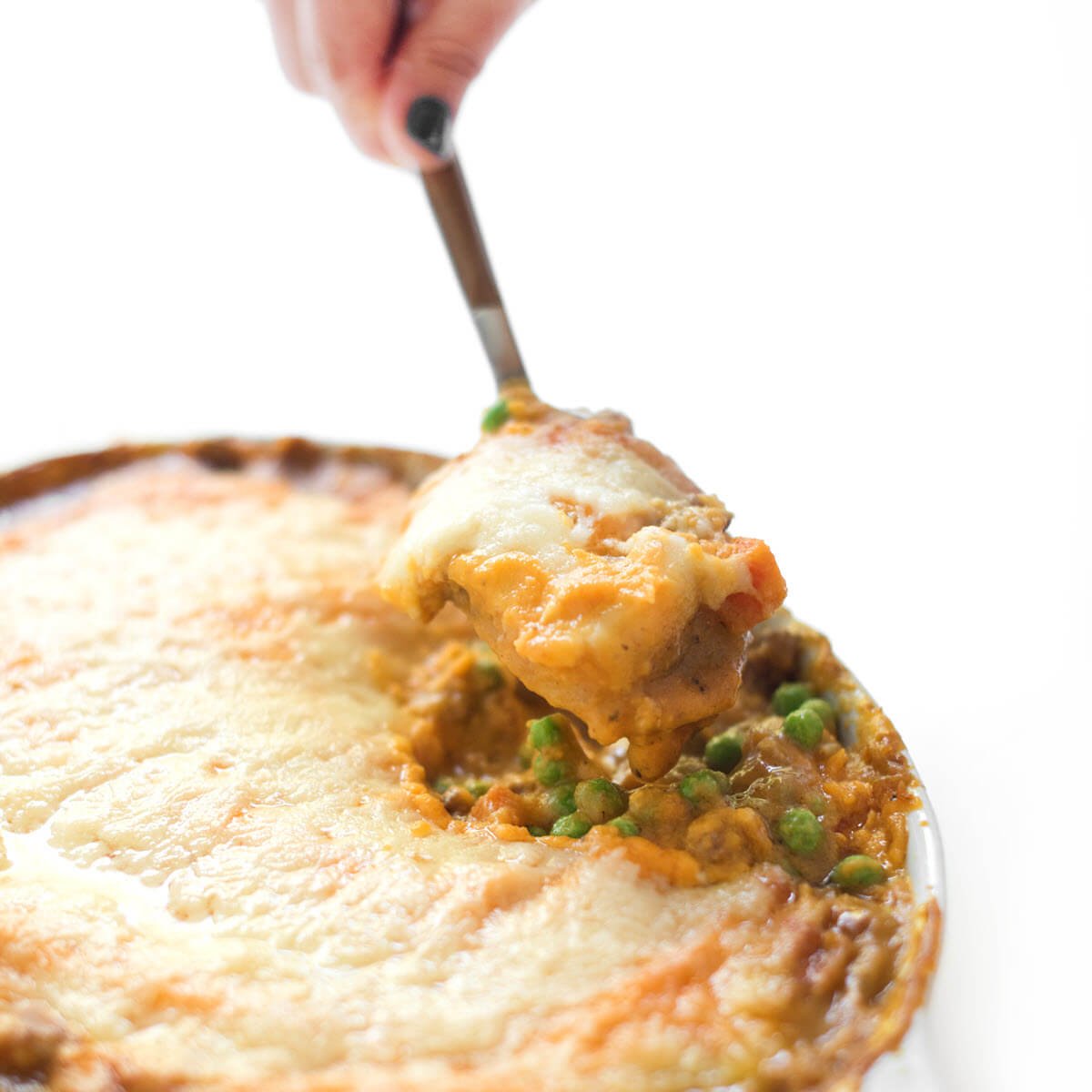 Sweet Potato Shepherd's Pie on a plate with a spoon