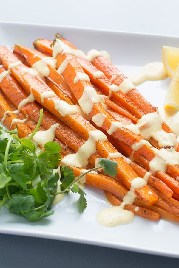 Moroccan Spiced Roasted Carrots with Lemon Yogurt Sauce - a flavorful side dish recipe