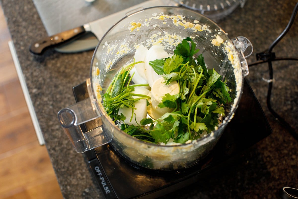 Parsley and onion in a food processor.