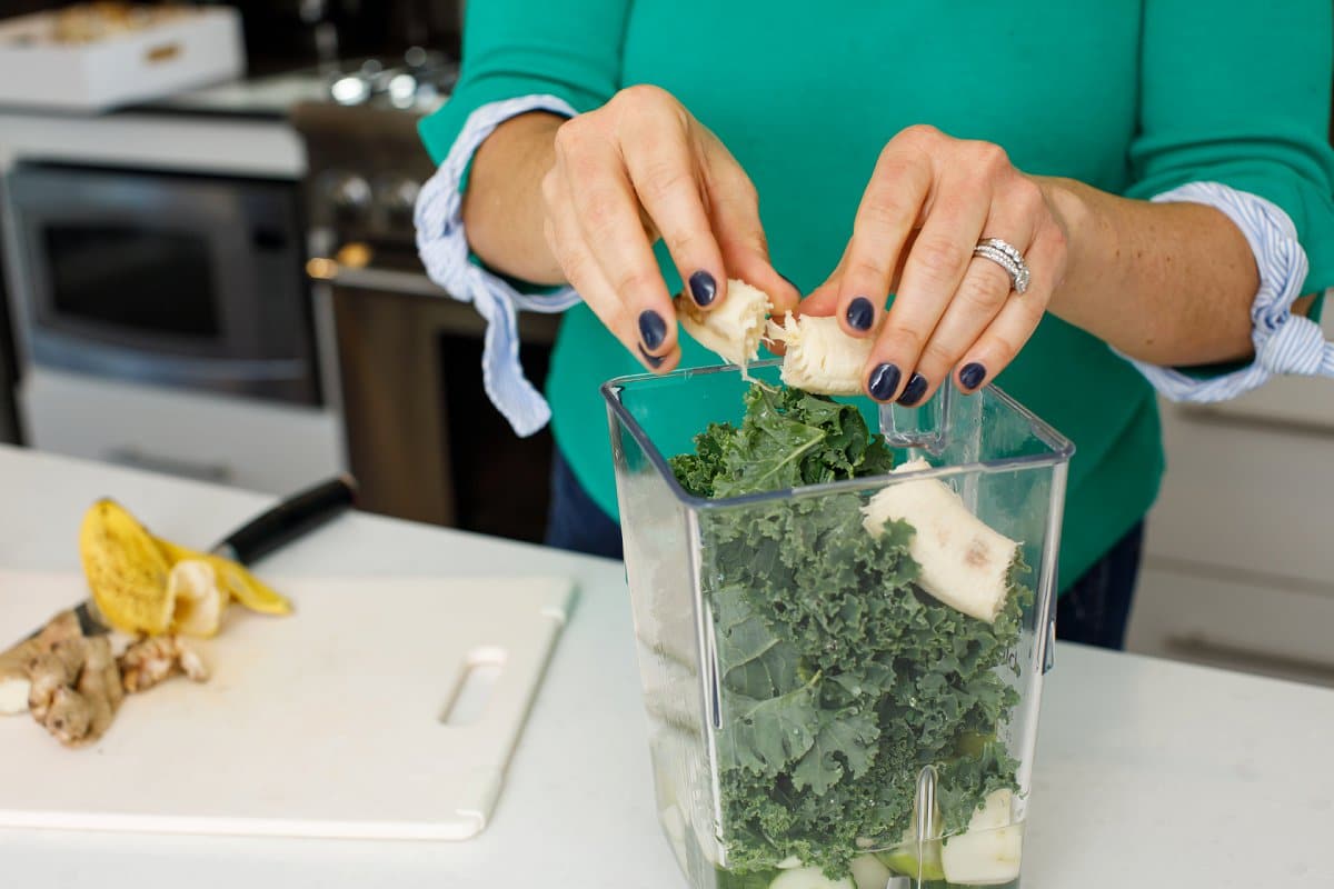 Liz breaking banana for a smoothie