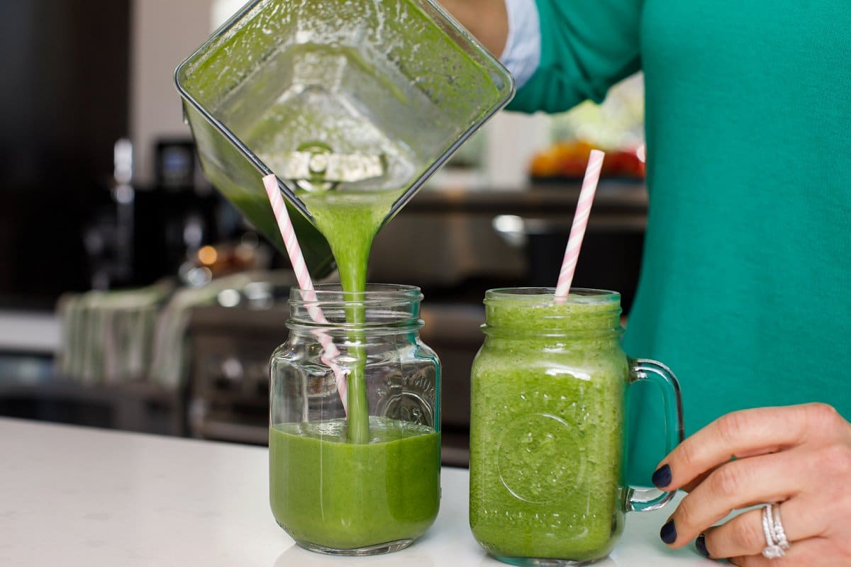 Liz pouring Cucumber Apple Green Smoothies
