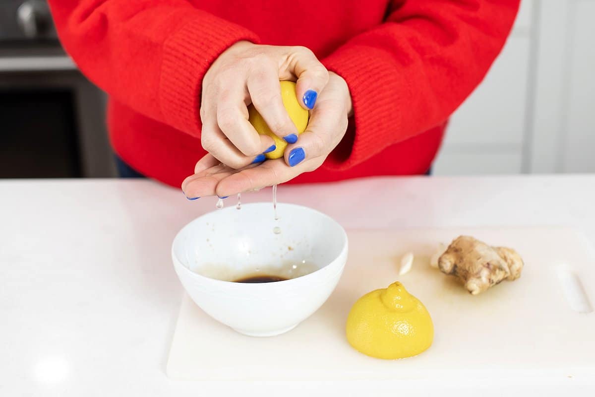 Liz squeezing a lemon