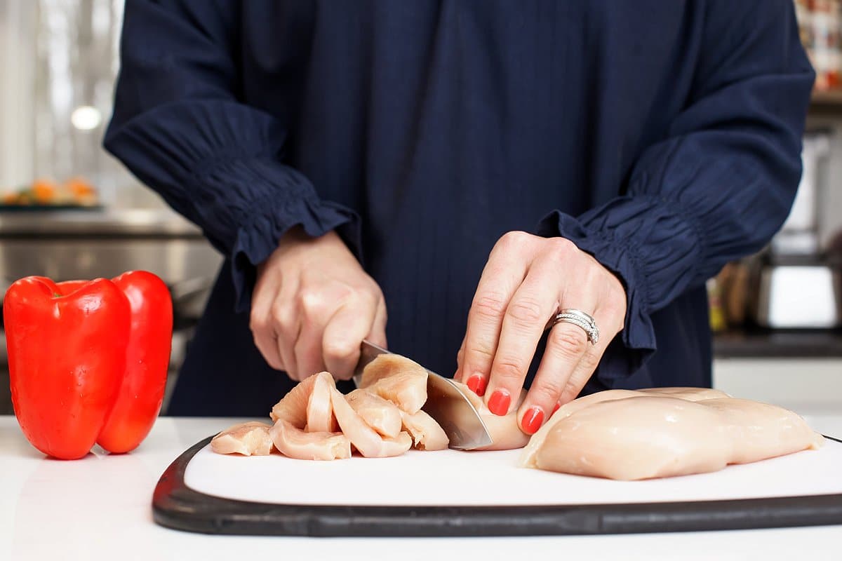 Liz cutting chicken