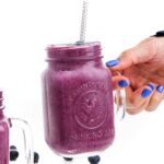 person holding a Blueberry Cinnamon Smoothie