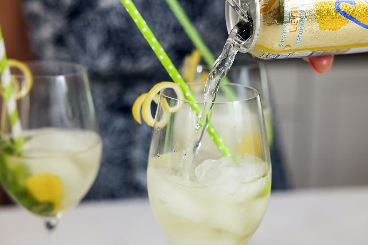 Pouring sparkling water for spritzer