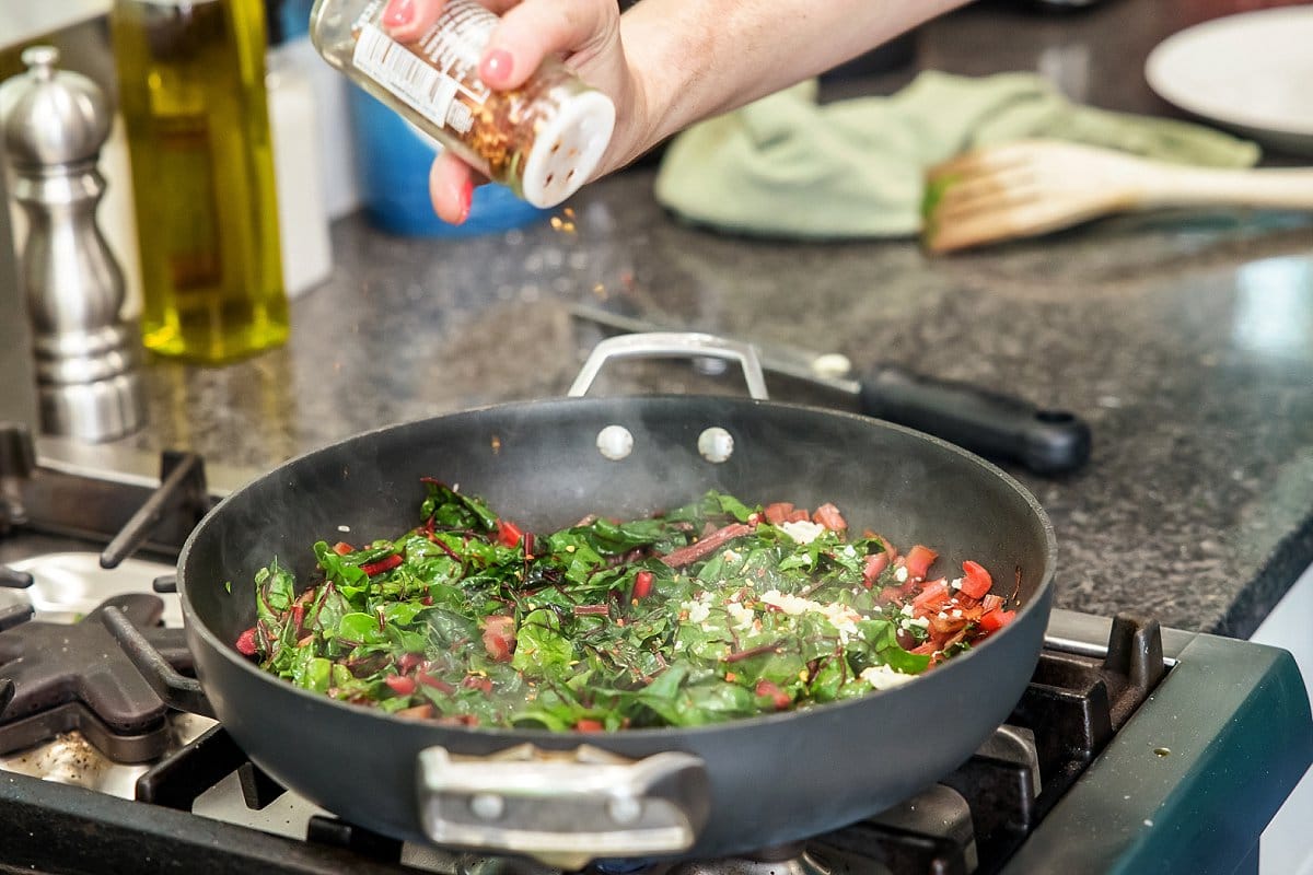 Adding spice to saute pan
