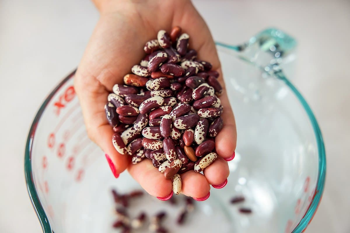 Putting dried beans in a bowl