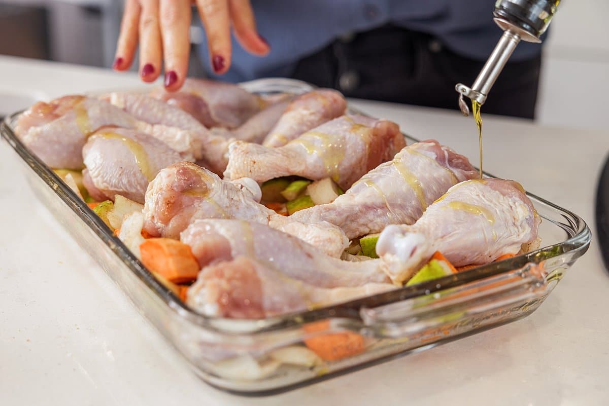 Chicken drumsticks in pan (raw)
