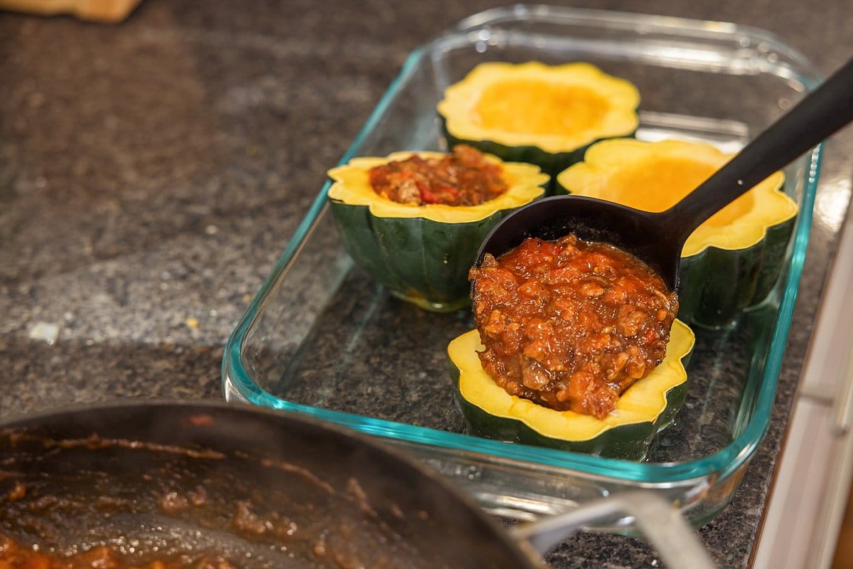 Filling acorn squash with stuffing
