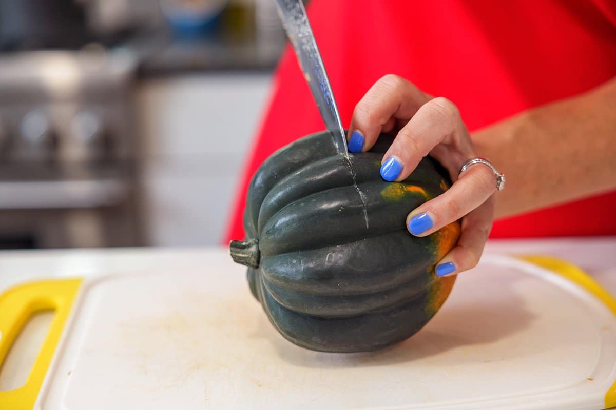 Liz cutting acorn squash.