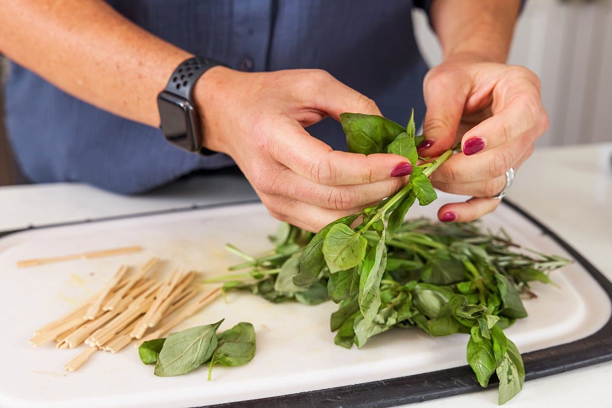 basil leaves on a cutting board