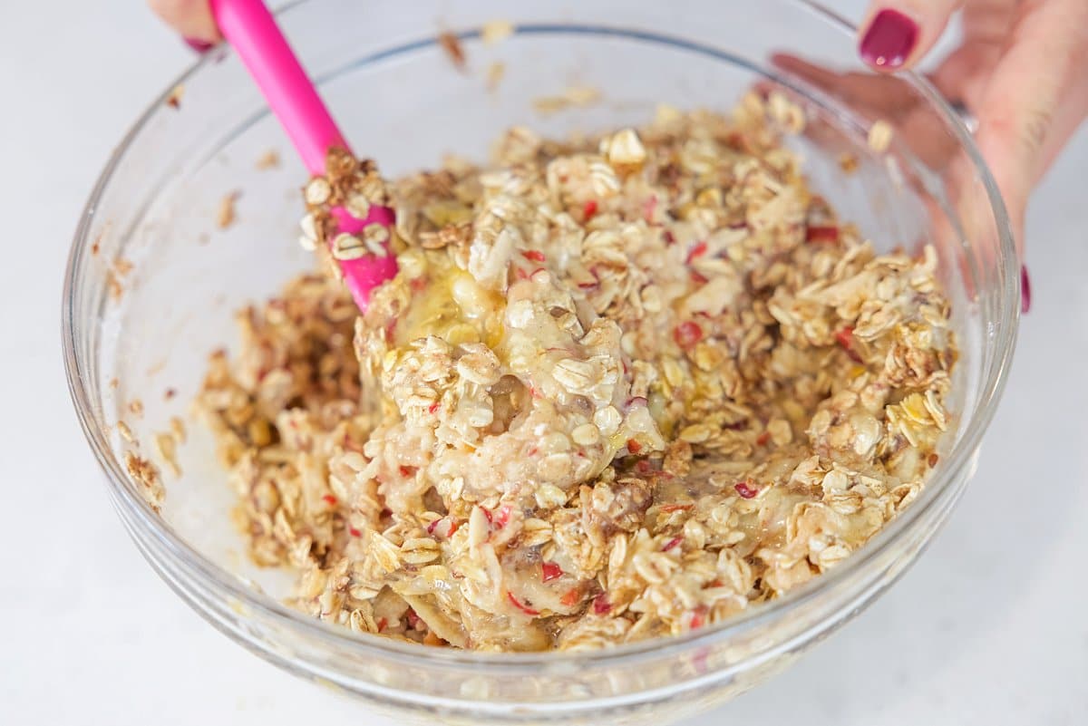 Mixing up pancake batter in a glass bowl.