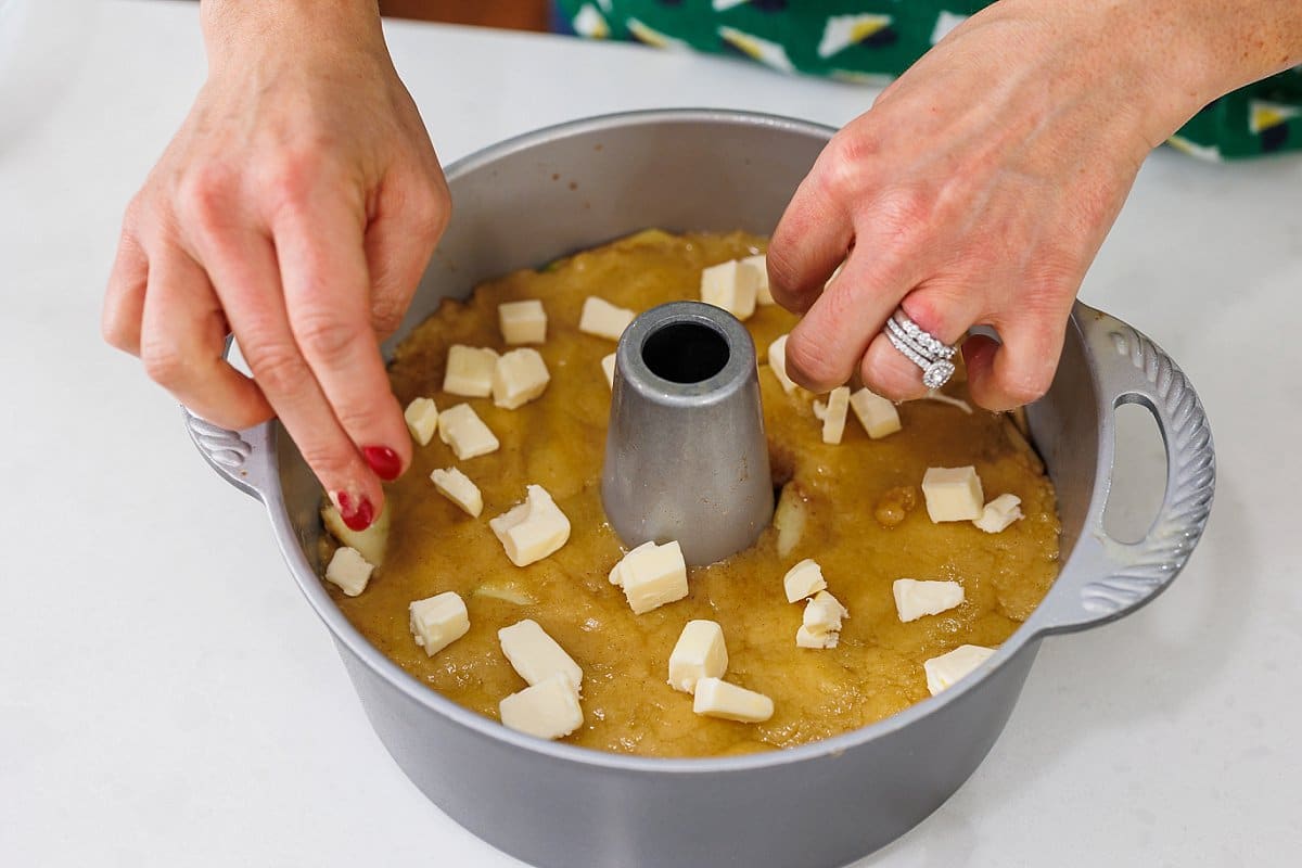 adding butter to a cake pan