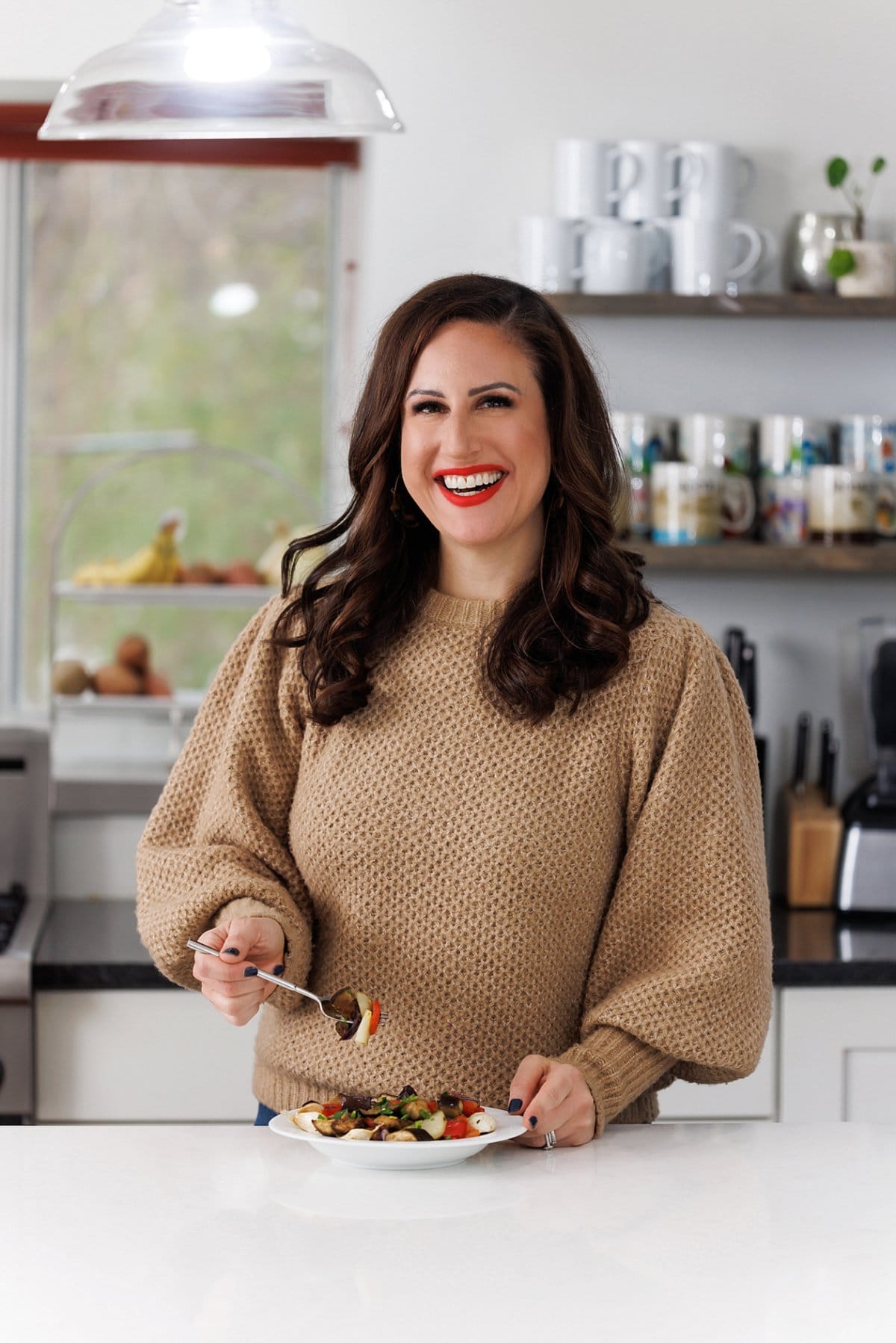 Liz enjoying Provencal roasted vegetables. 