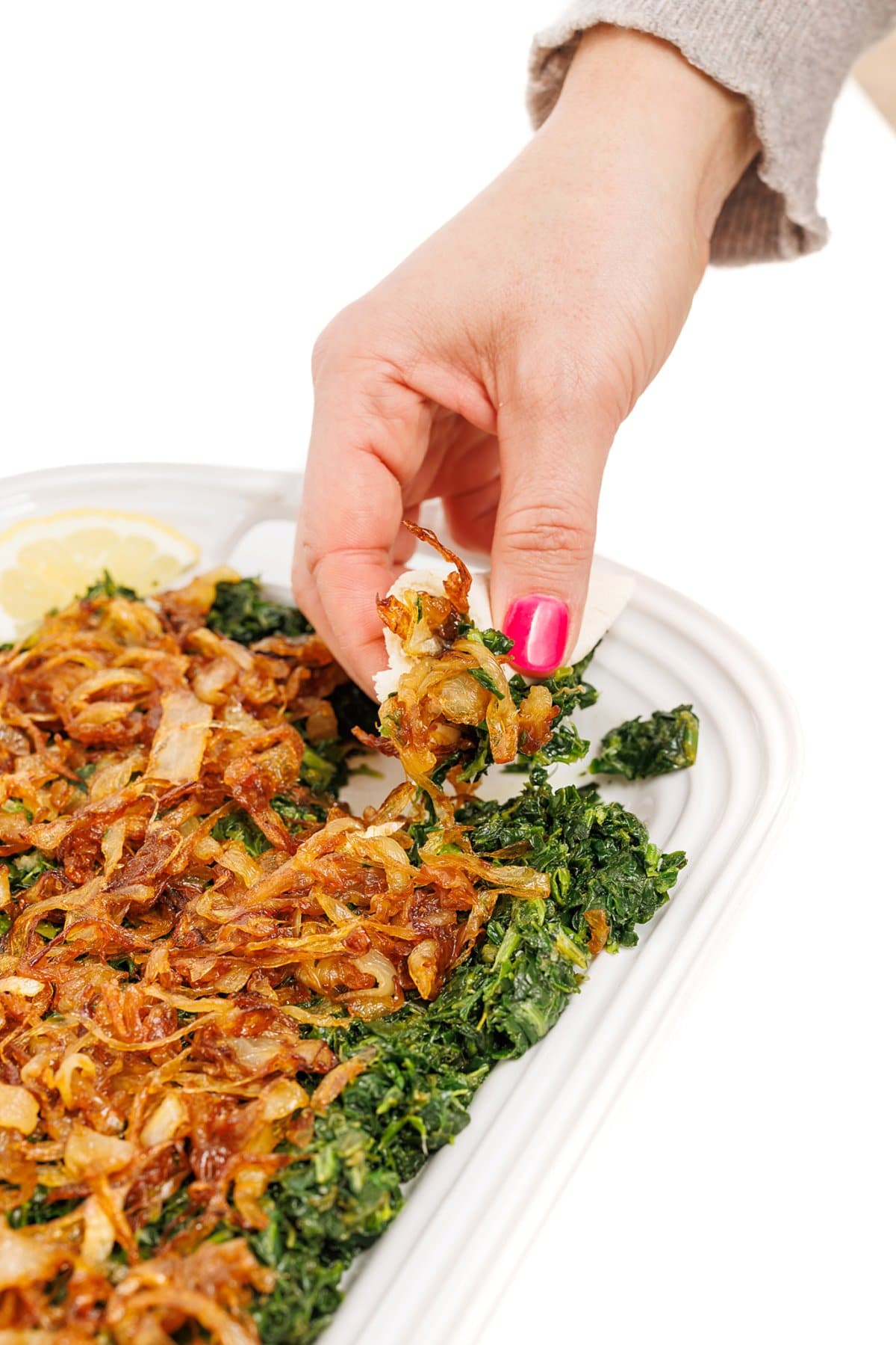 Picking up garlicky greens with caramelized onions.