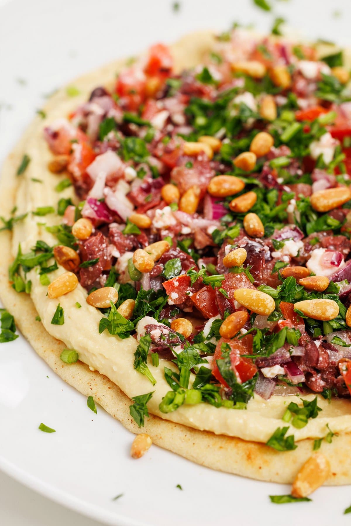 Hummus pizza with Greek tapenade.