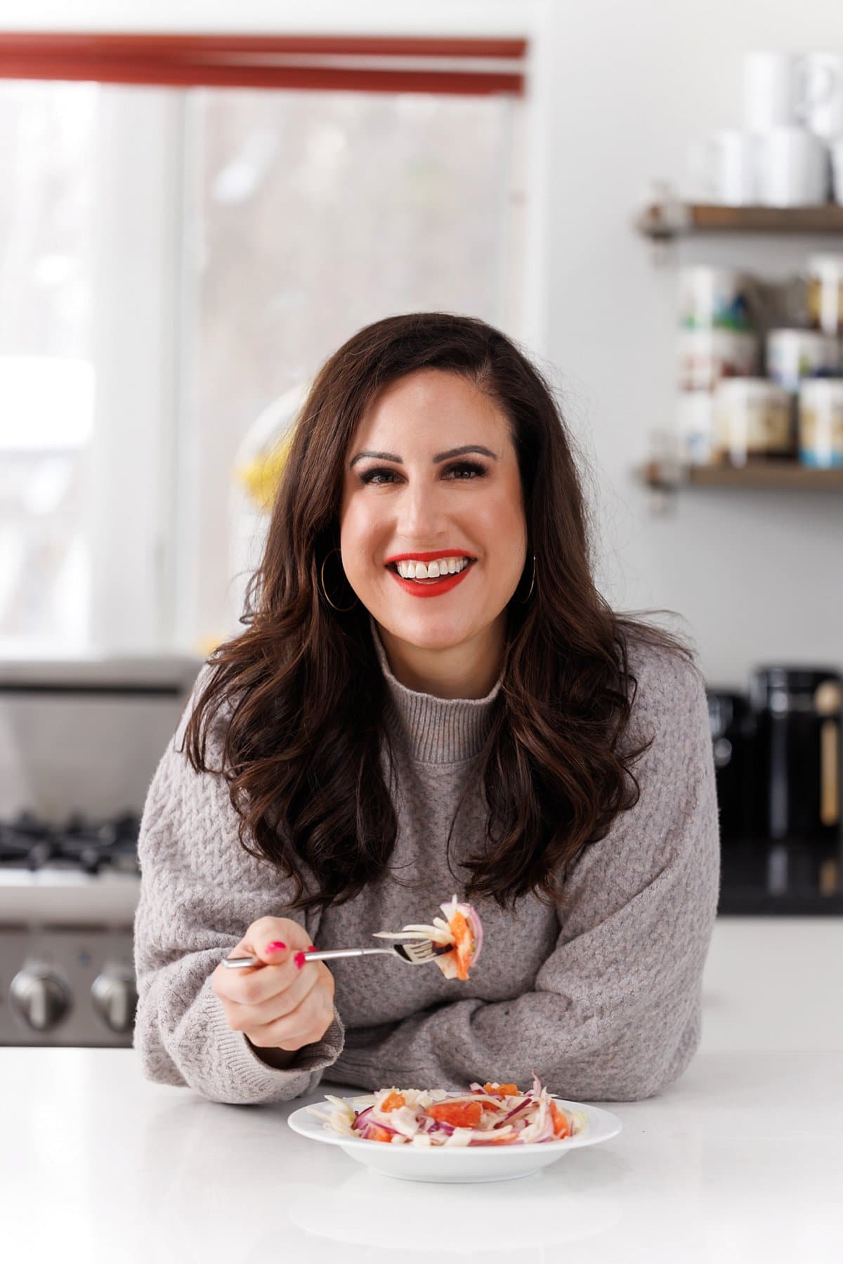 Liz eating orange, fennel, and red onion salad.