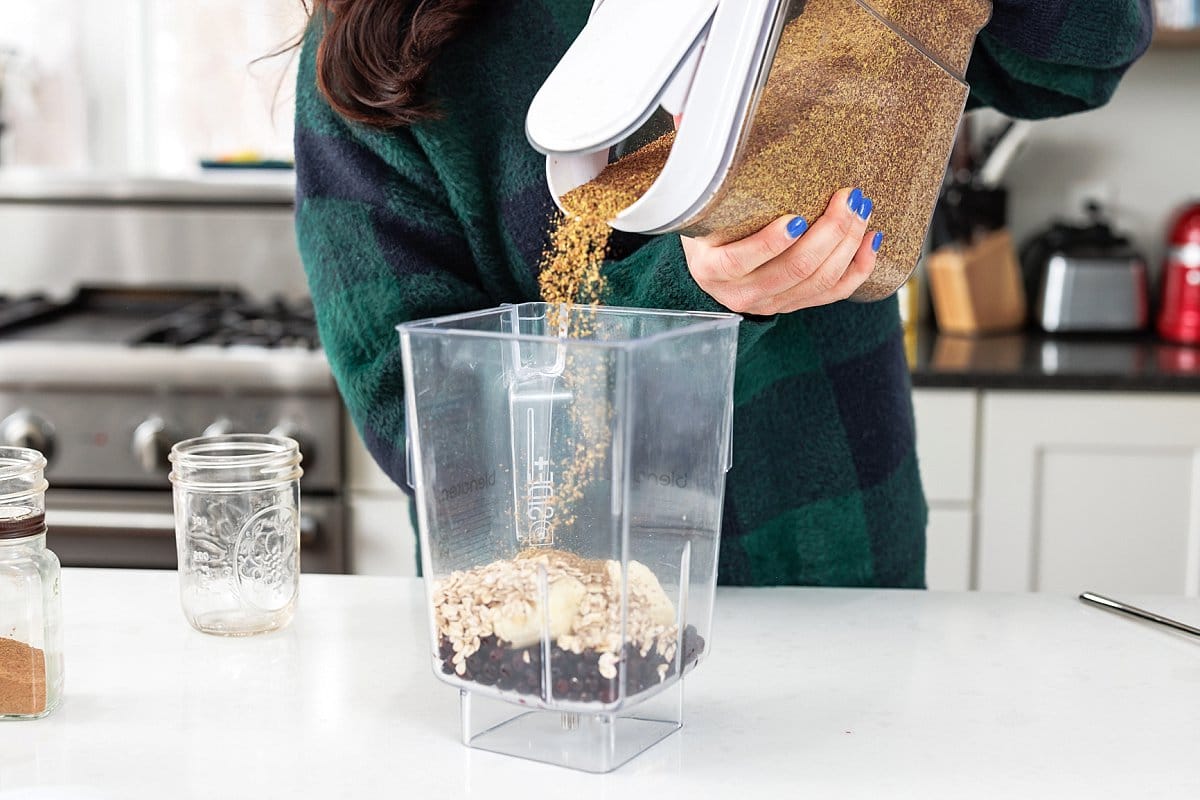 Adding flaxseed to blender.