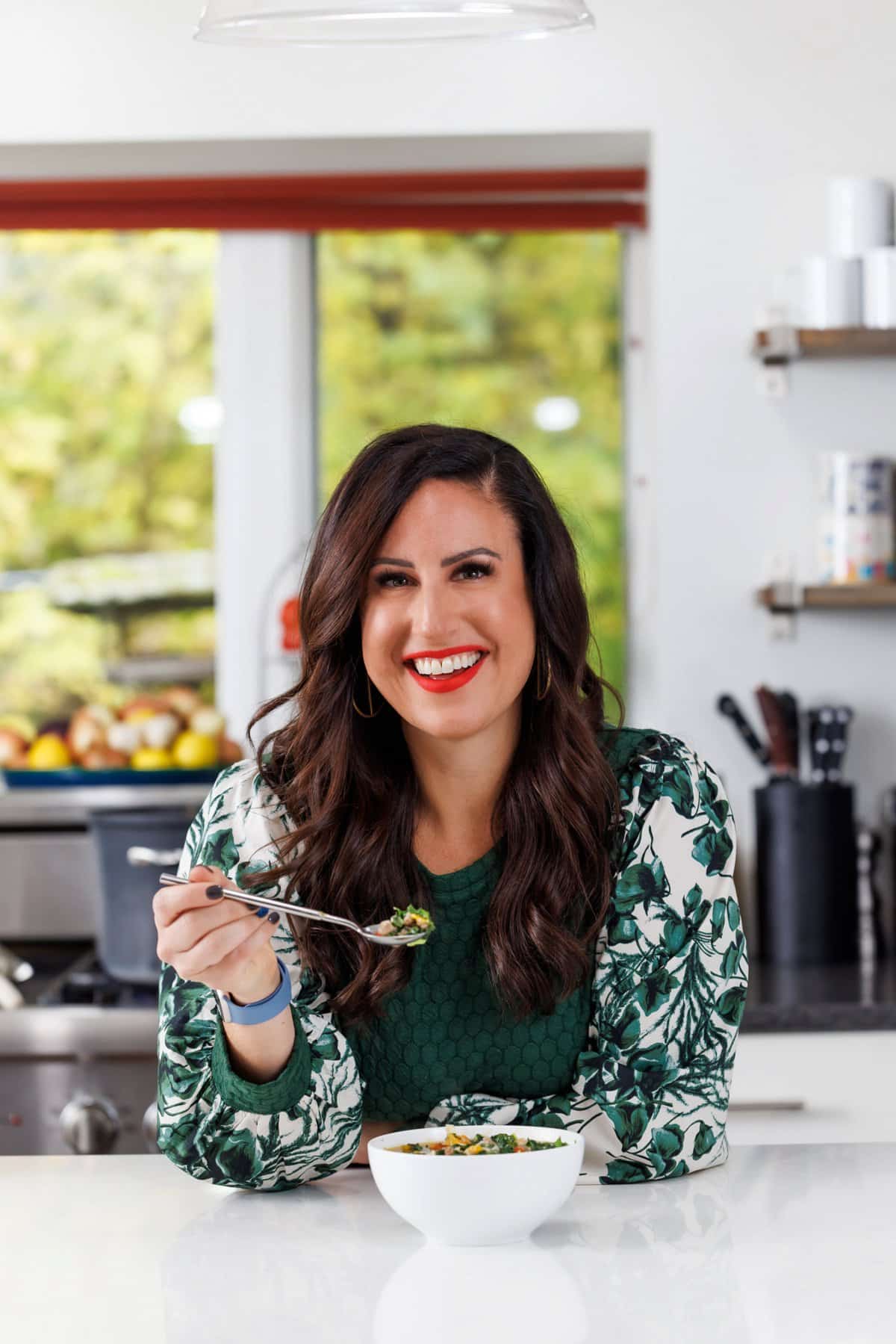 Liz enjoying sausage, kale, and butternut squash soup.