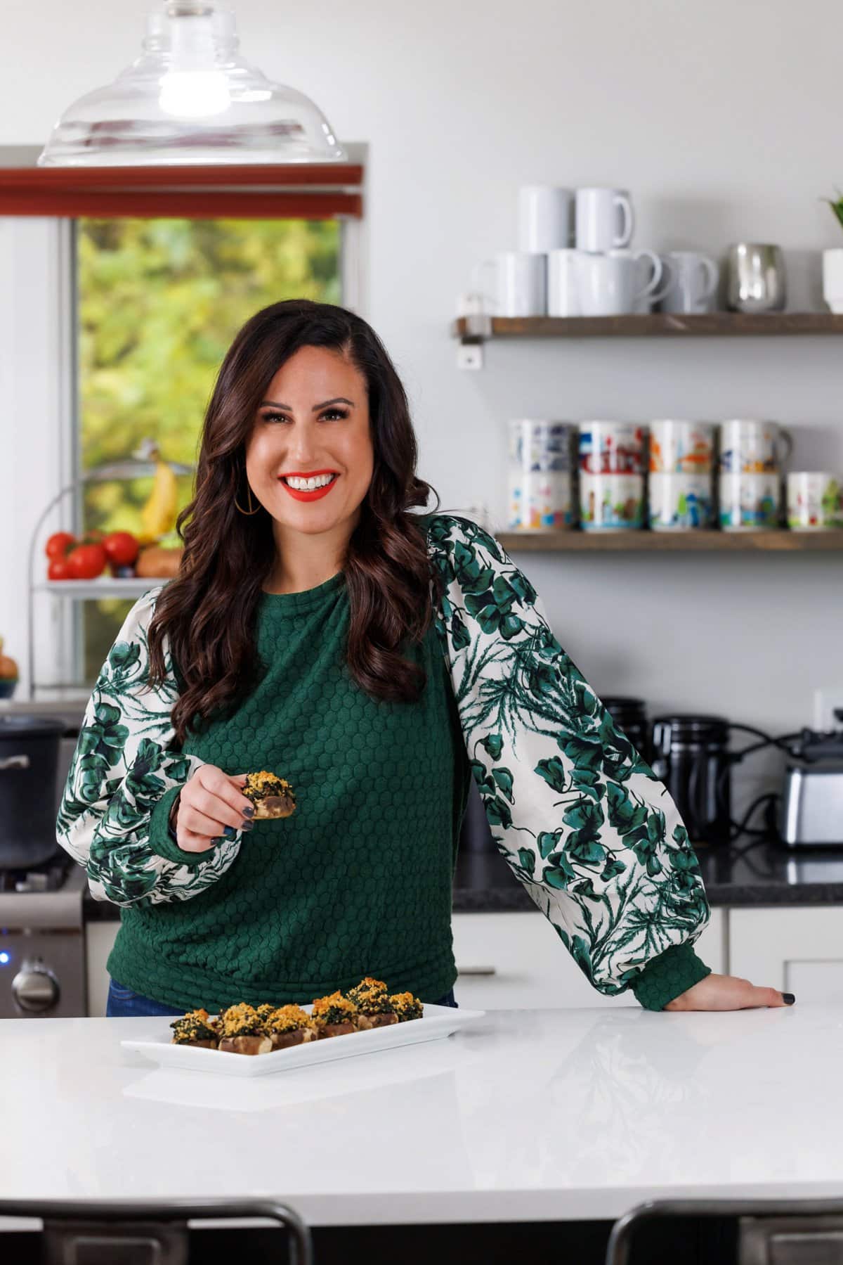 Liz enjoying vegan stuffed mushrooms.