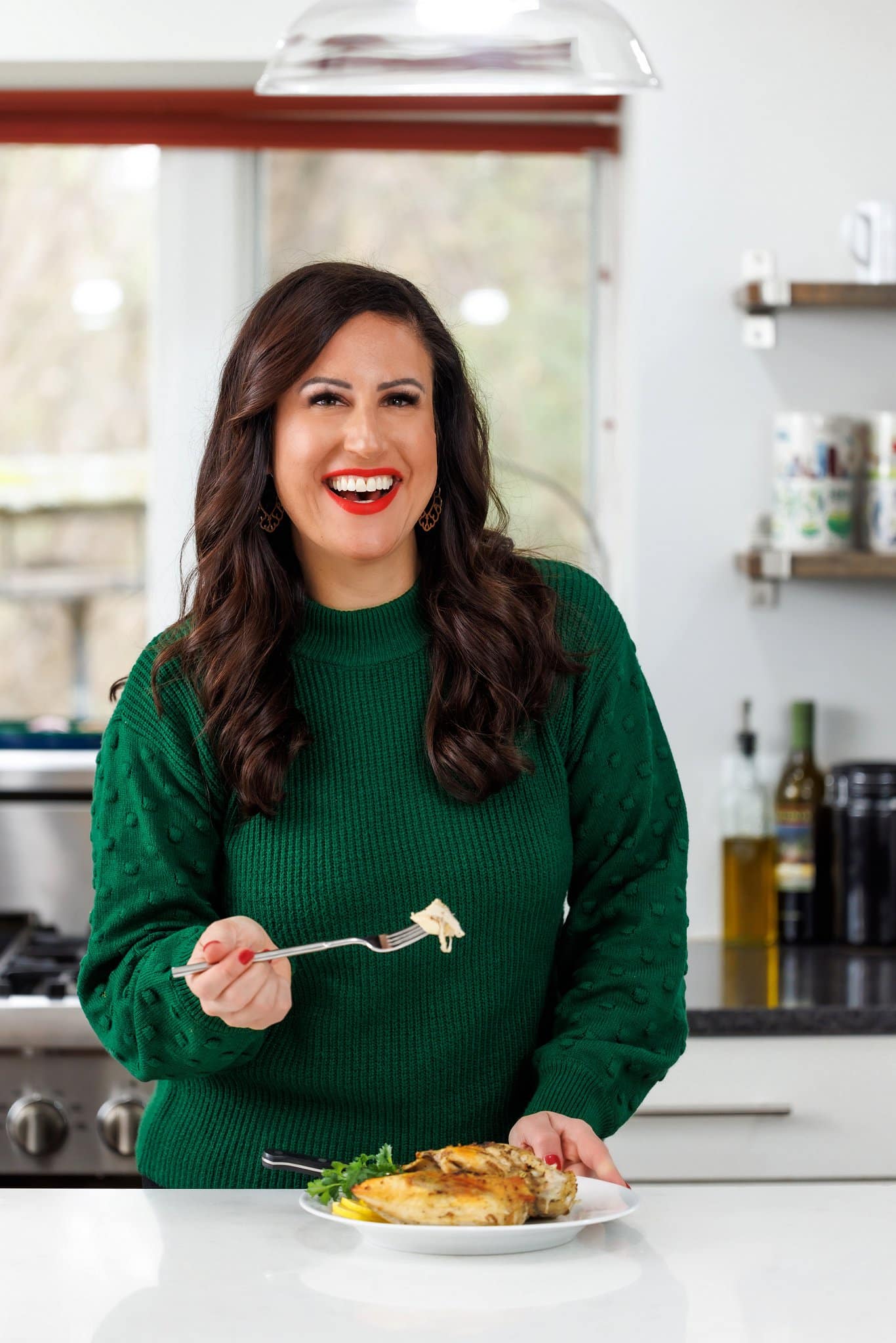 Liz eating lemon pepper baked chicken.