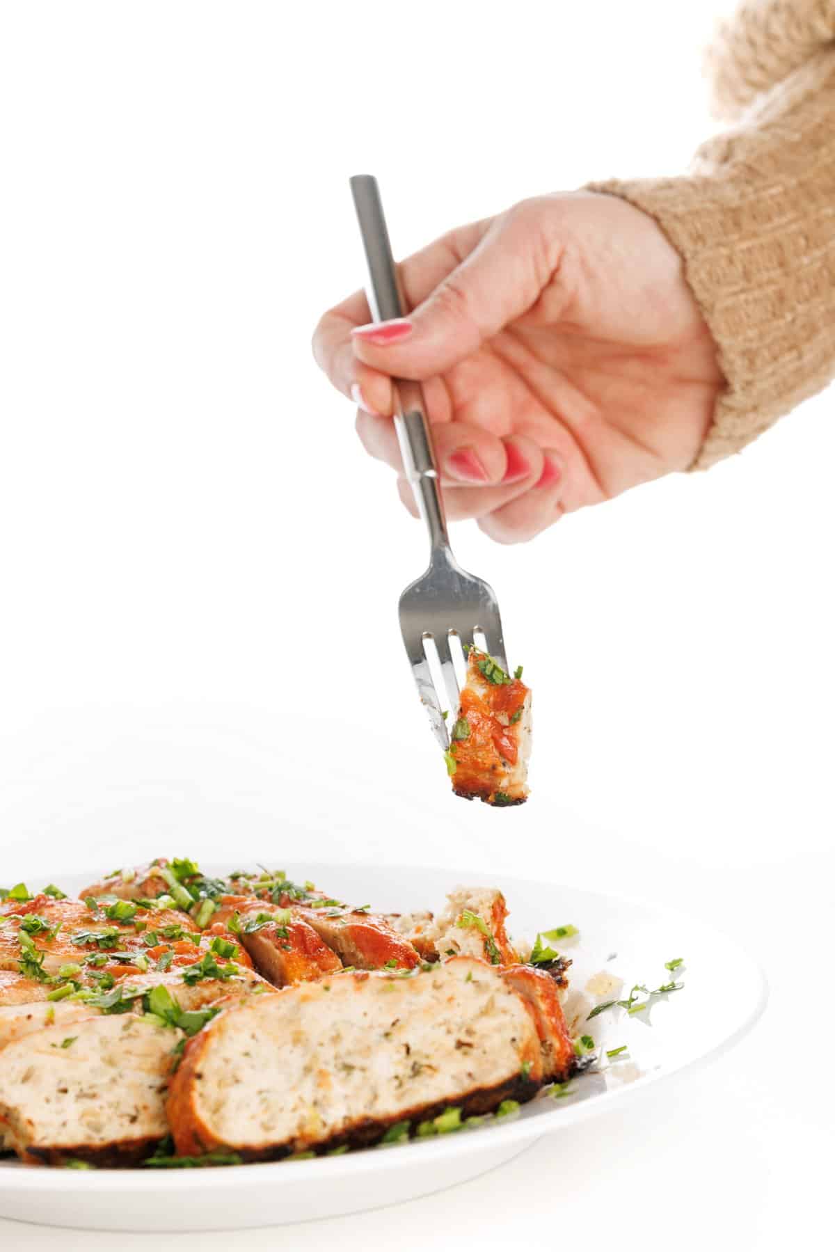 Forkful of turkey meatloaf with rosemary.