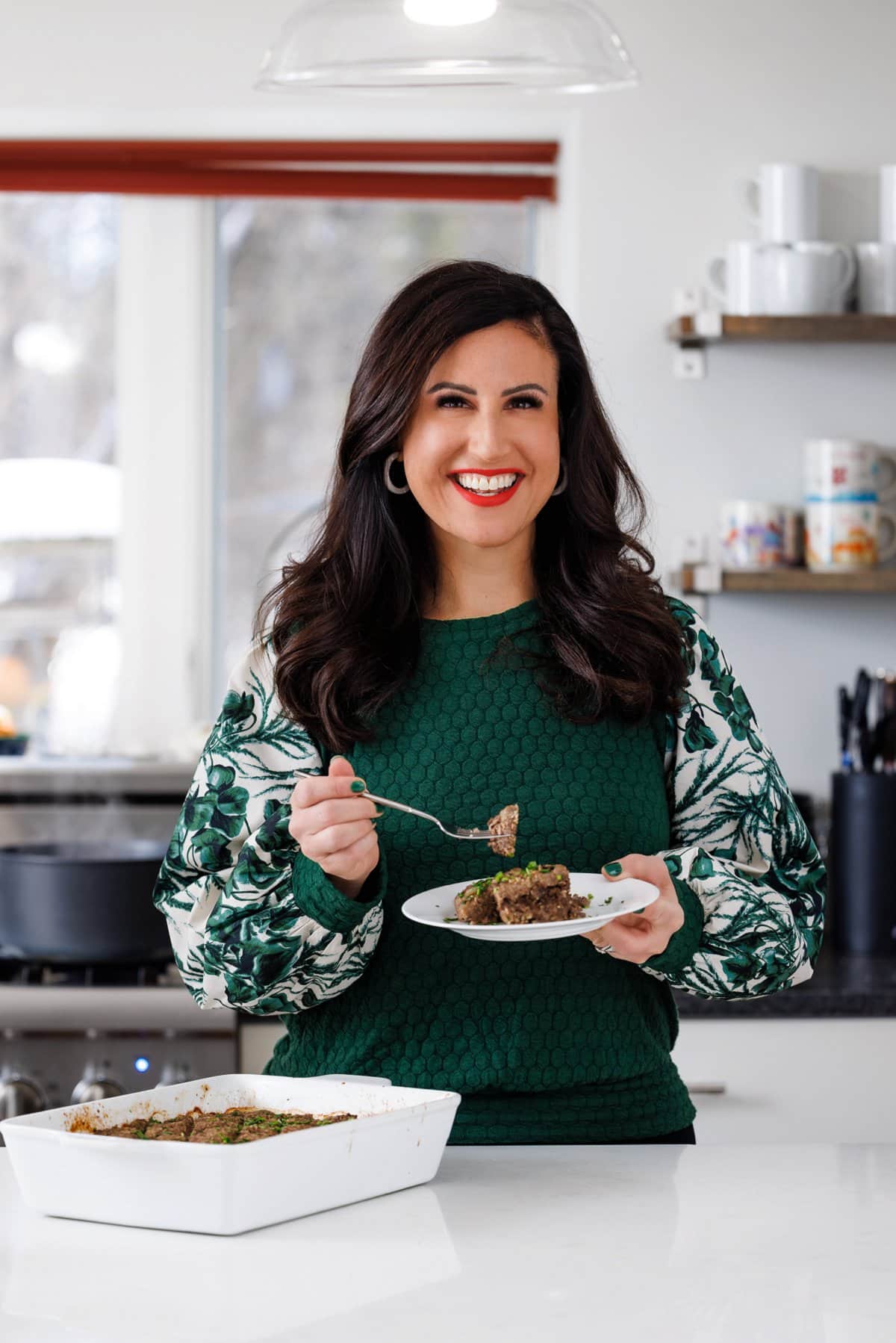 Liz eating baked kibbeh.