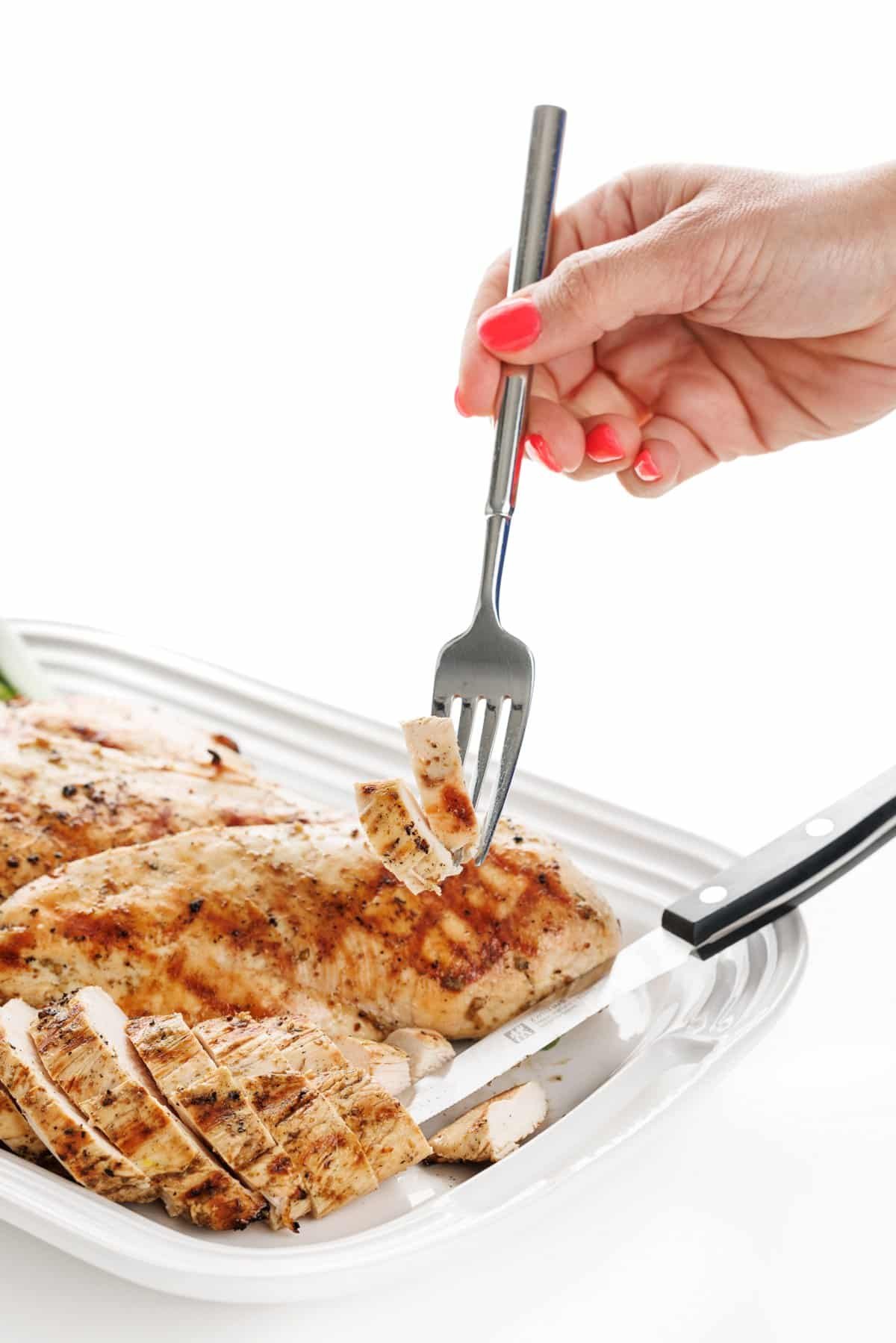 Forkful of za'atar spiced grilled chicken.