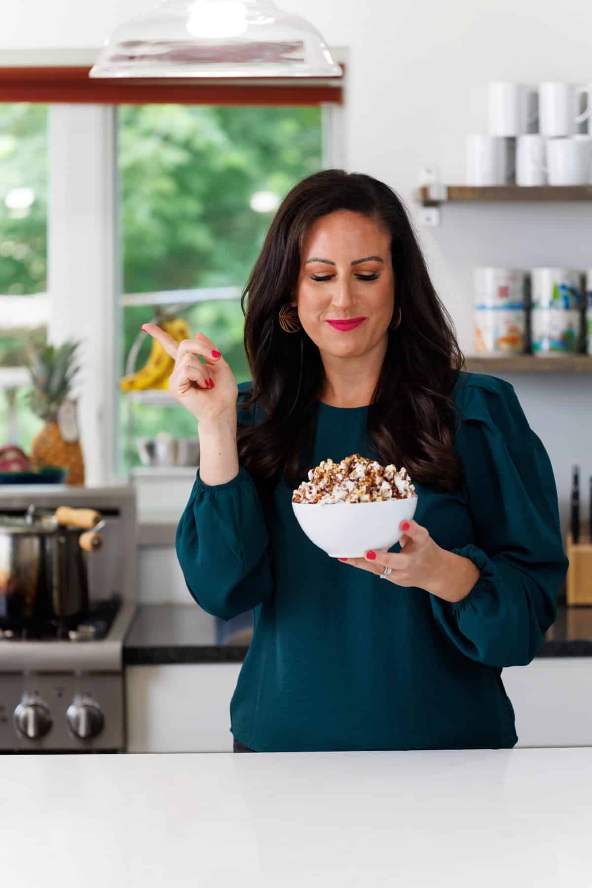Liz eating chocolate peanut butter popcorn.