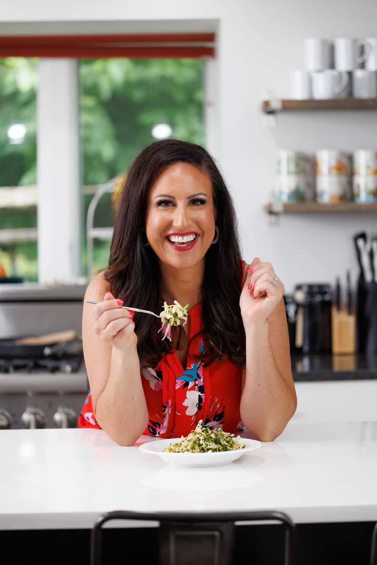 Liz eating Asian cabbage slaw with ginger vinaigrette.