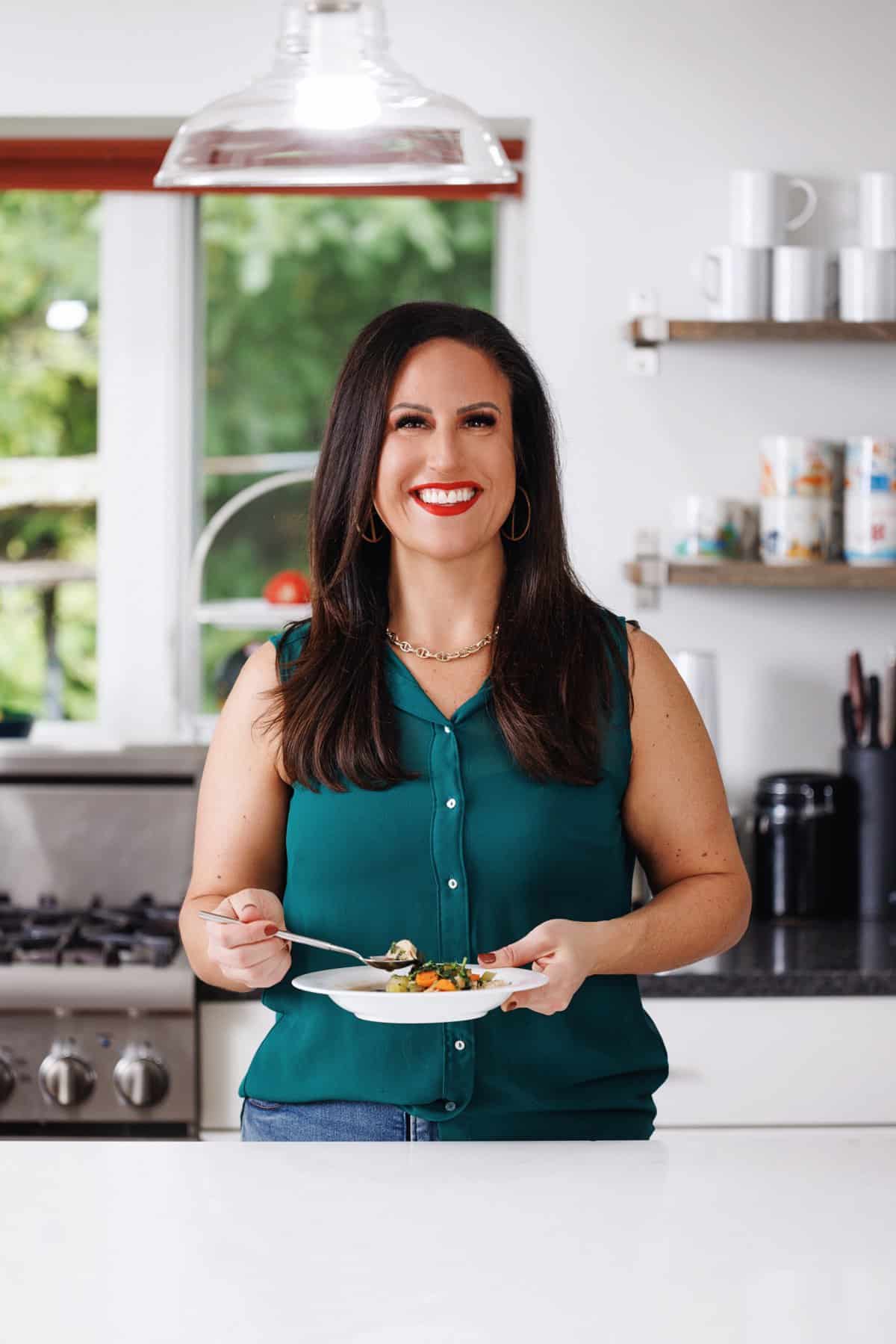 Liz eating Easy chicken soup with greens.