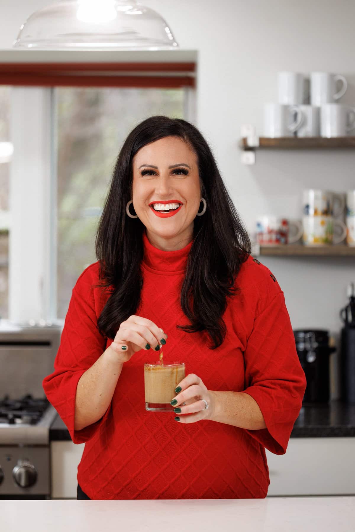Liz drinking a gingerbread cookie smoothie.