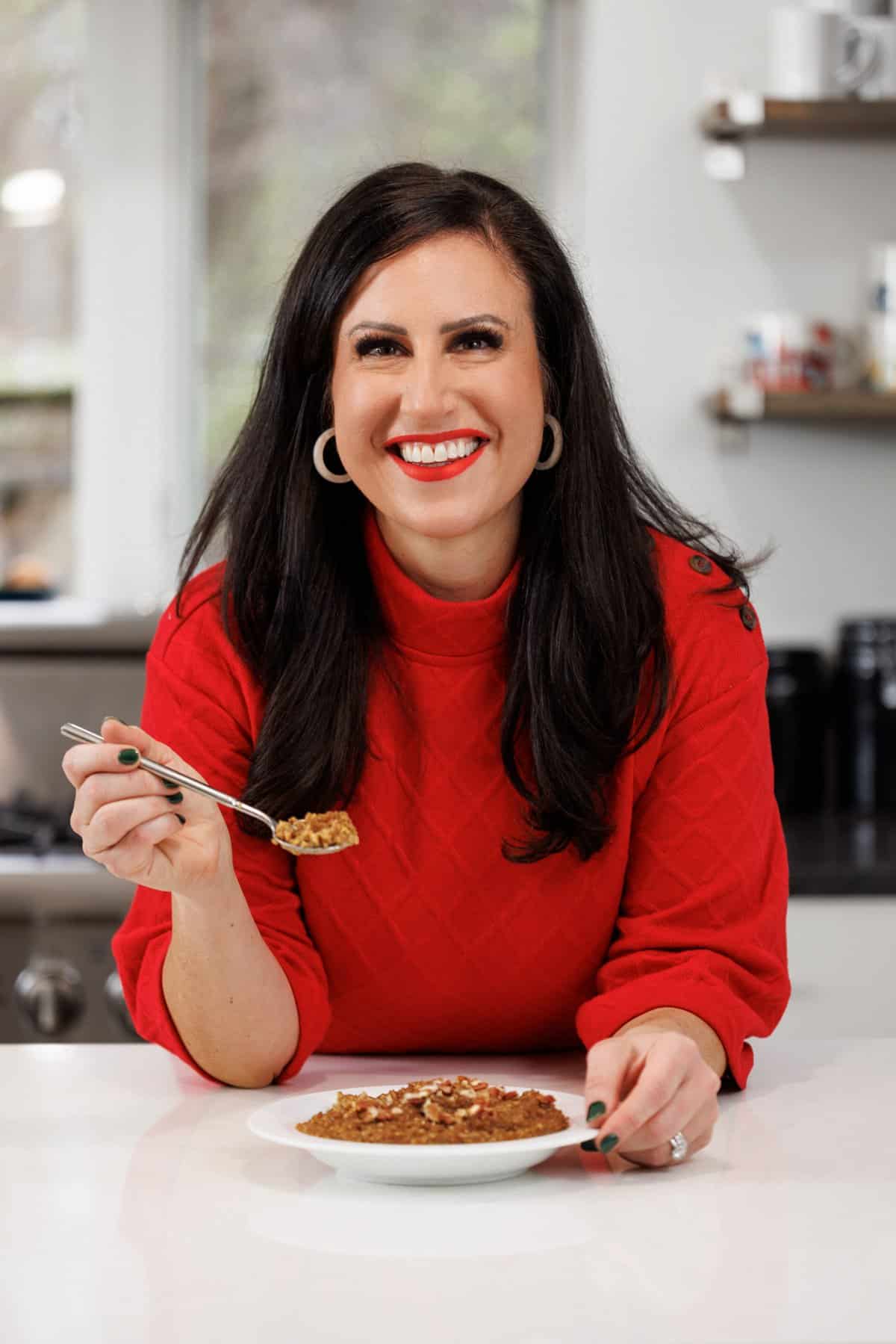 Liz eating slow cooker gingerbread oatmeal.