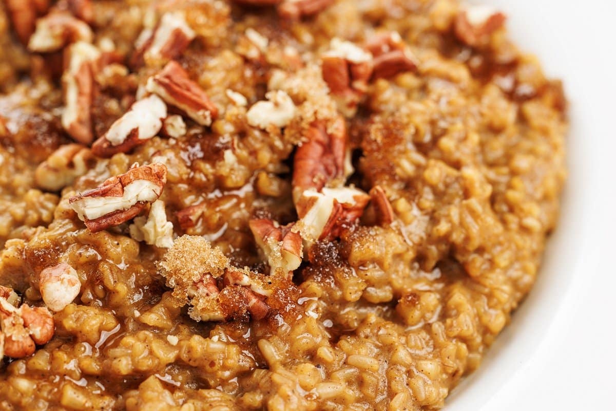 Slow cooker gingerbread oatmeal up close topped with walnuts, one of 20 cozy oatmeal recipes.