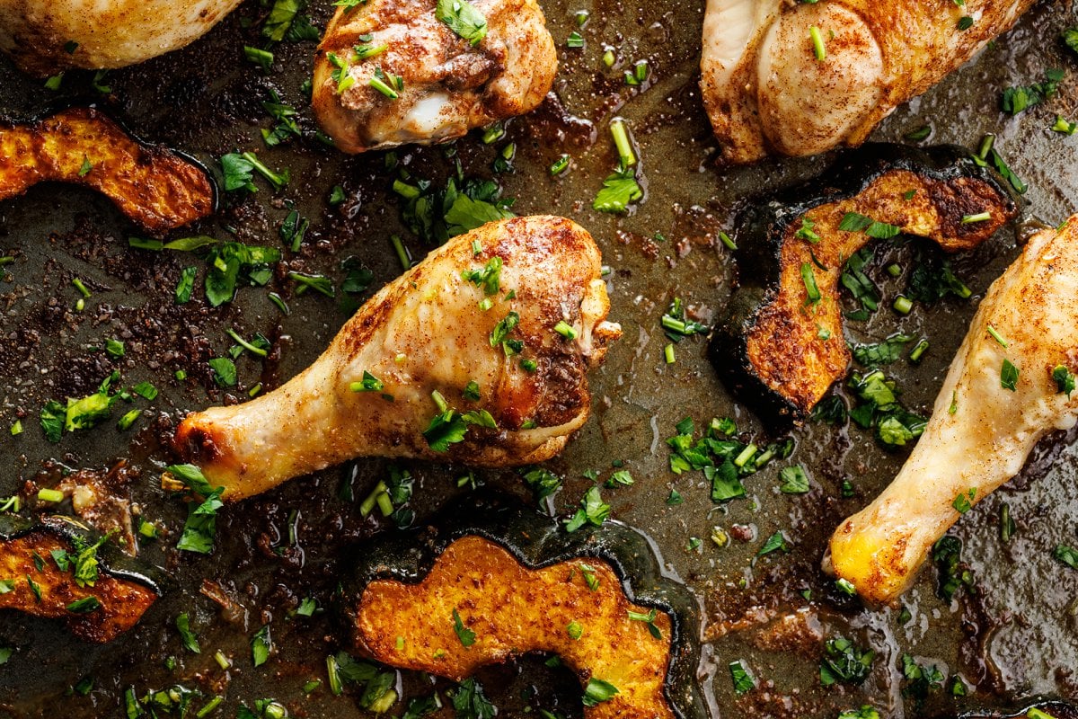 Chicken and acorn squash sheet pan dinner up close.
