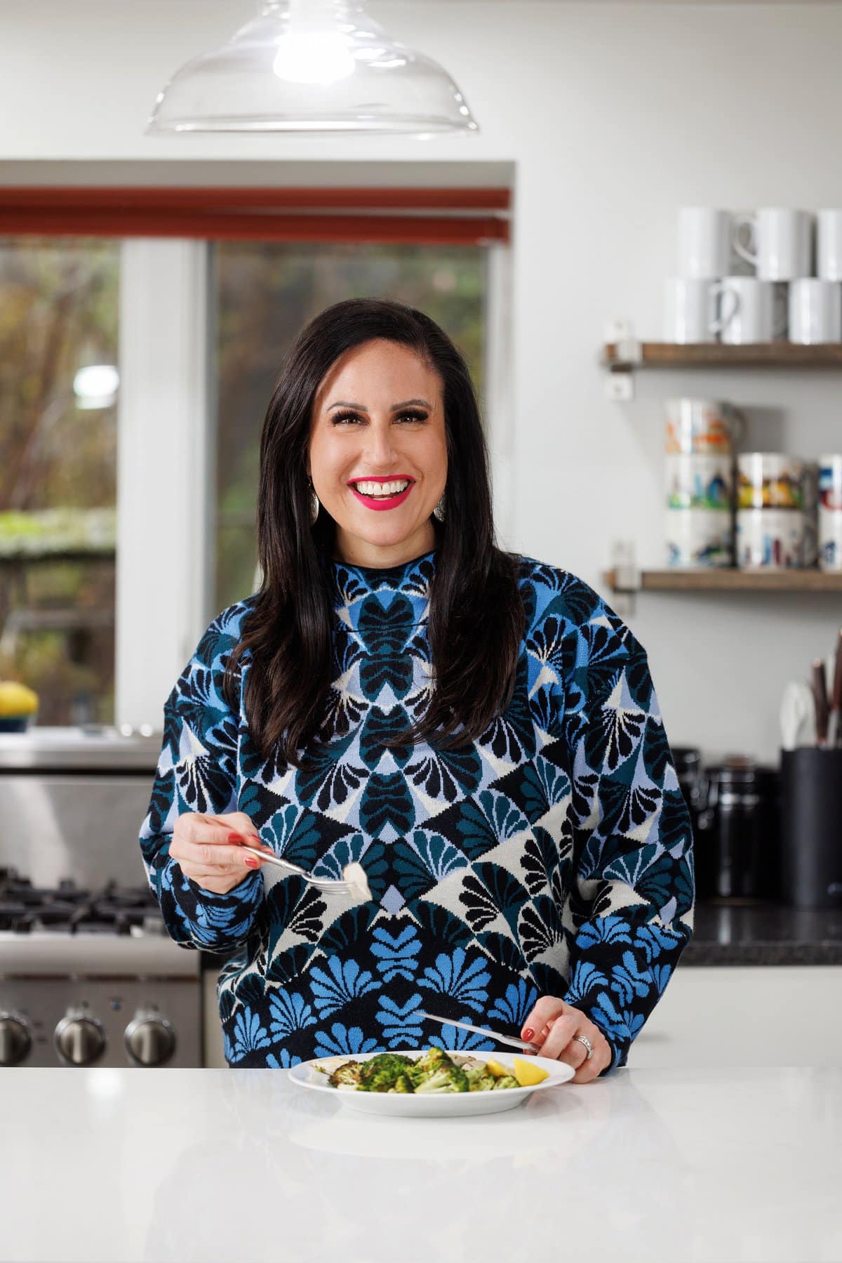 Liz eating one pan roasted chicken and broccoli.