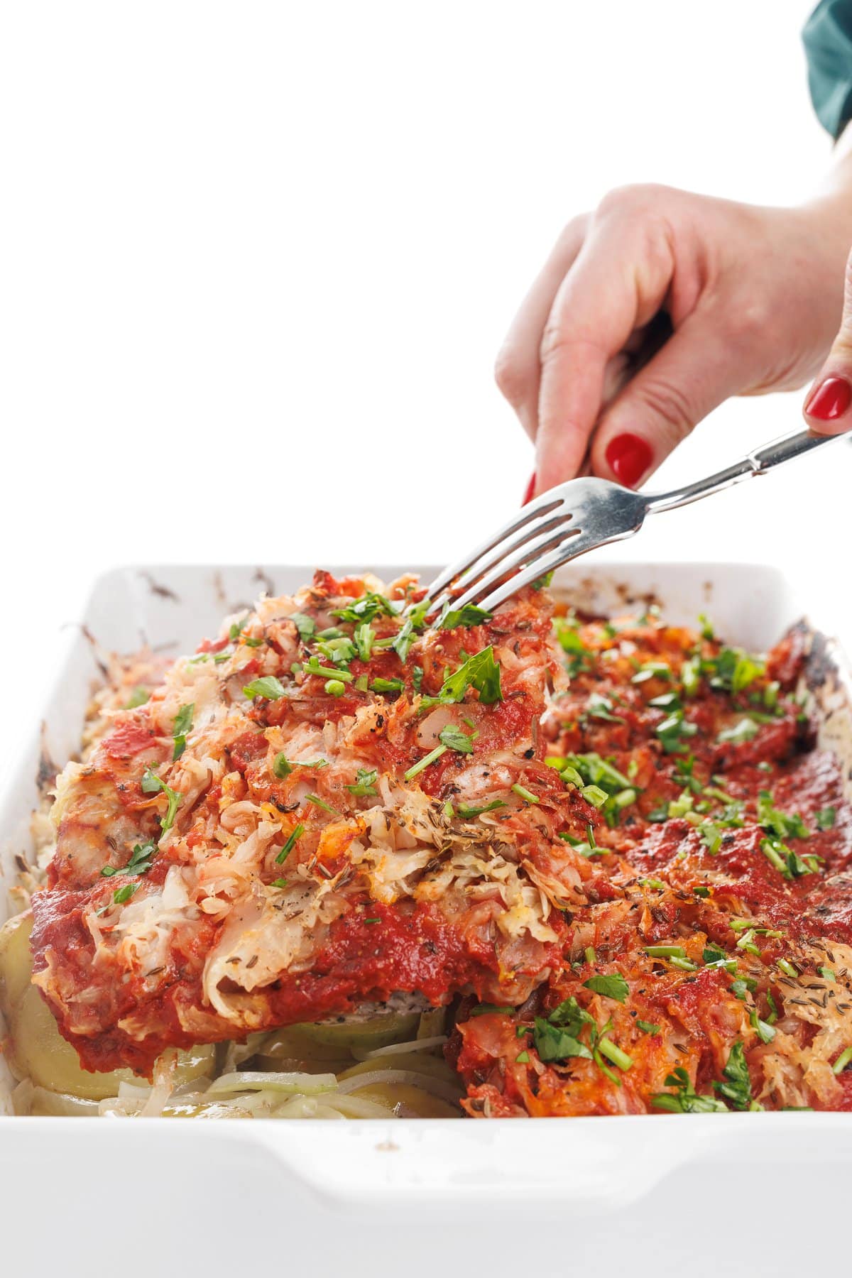 Serving oven baked pork chops with potatoes.